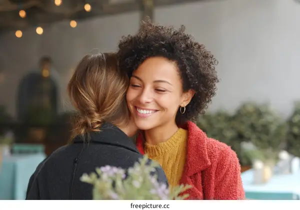 Two Women Embrace in a Warm Embrace