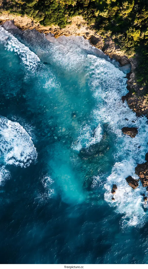 Aerial View of Turquoise Ocean Water and Cliff Coastline