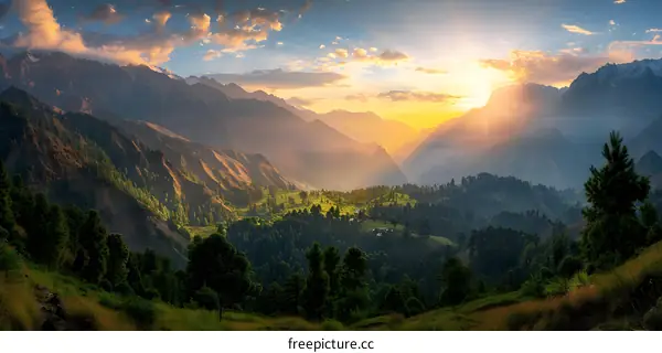 The sun shines through the valley between mountains