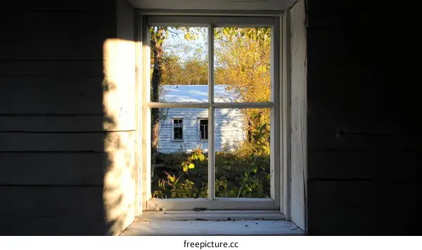 Sunlight Through a Window to an Old House