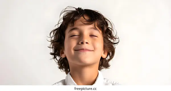 Young Boy with Eyes Closed and Smiling