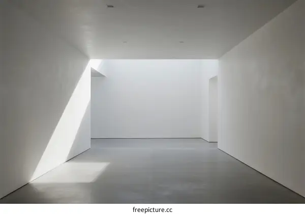 Empty white room with natural light coming in through a gap