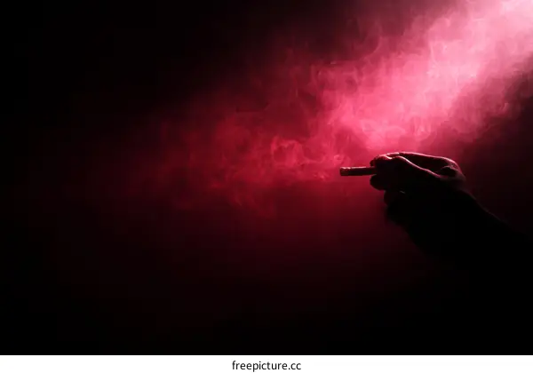 Smoking Hand Silhouette in Red Smoky Background