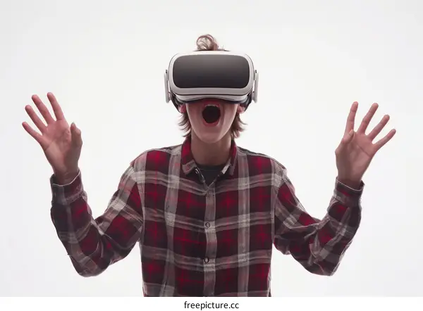 Young male gamer in virtual reality headset