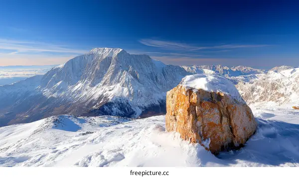 Majestic Winter Mountain Landscape with Snow-Covered Rock