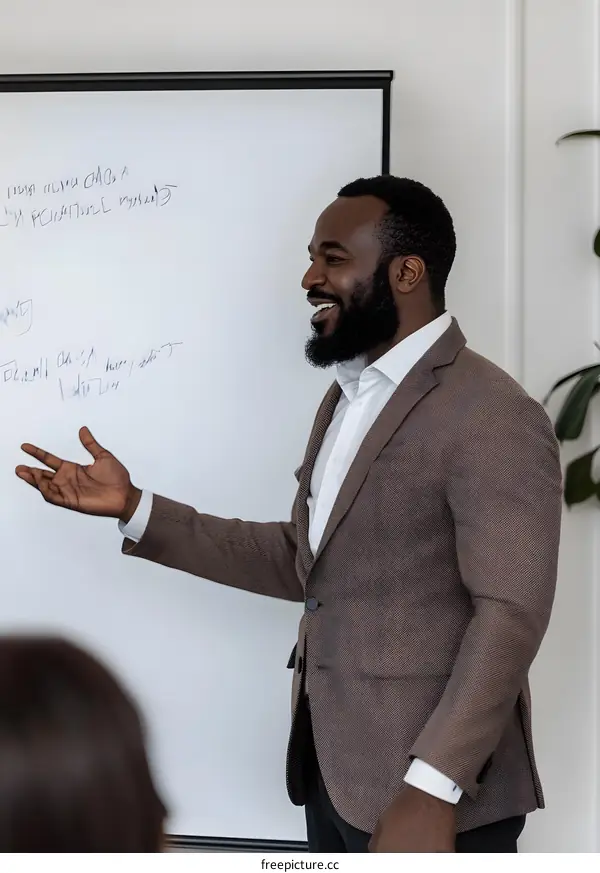 African American Businessman Giving Presentation On Whiteboard