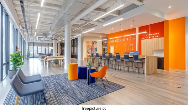 Modern Open-Plan Office Workspace with Orange Accents