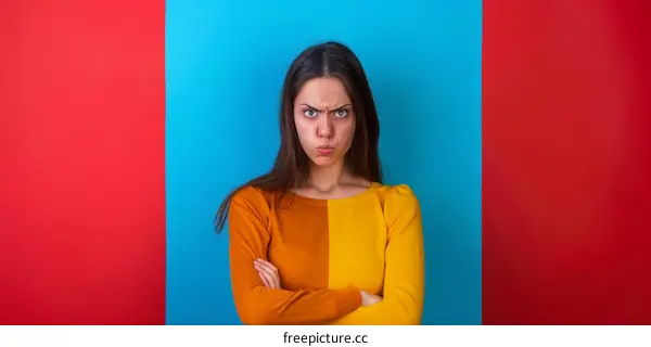 Young woman with crossed arms looking angry or upset