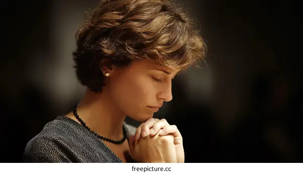 Woman Praying in Reflection and Devotion