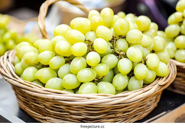 Close Up of Fresh Green Grapes in Wicker Basket
