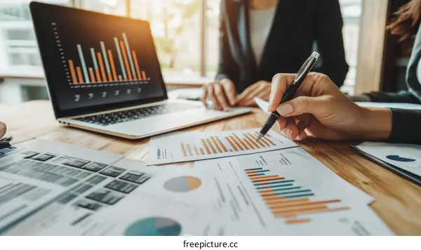 Business Meeting with Charts and Documents
