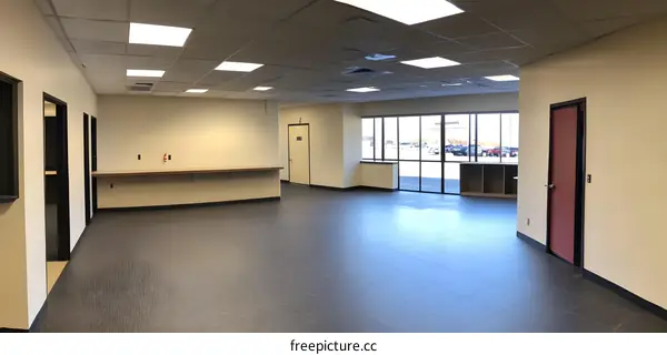 Modern Office Interior with Large Windows and Beige Walls