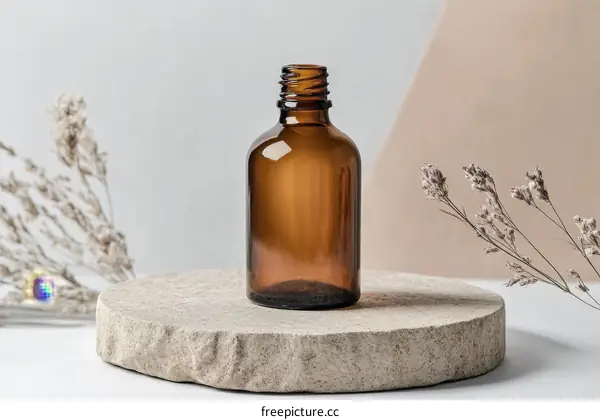Brown Glass Bottle on Stone Display Stand