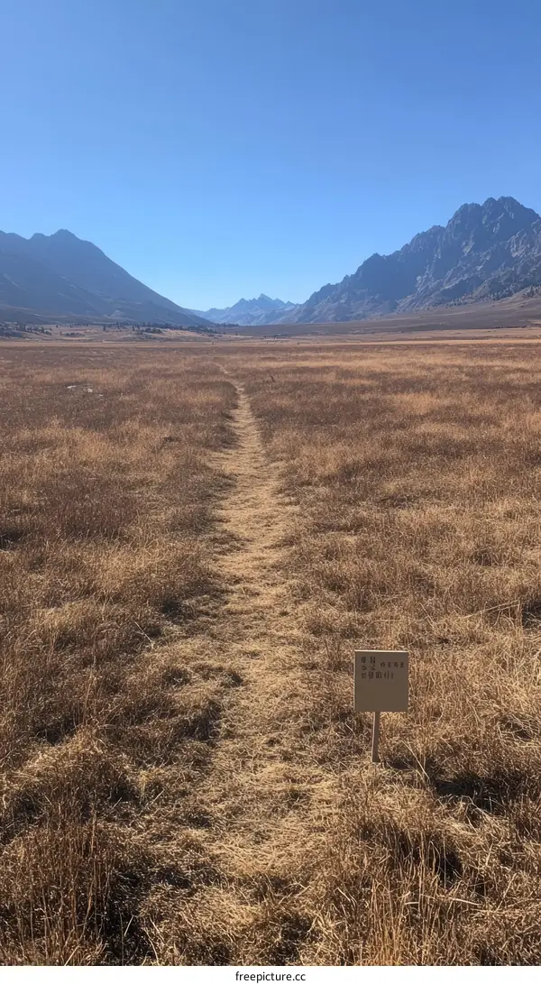 Mountain Trail Through Dry Grassy Valley