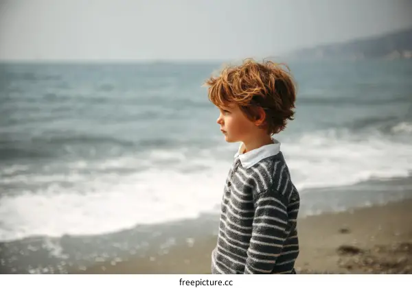 A Child on the Beach at the Oceans Edge
