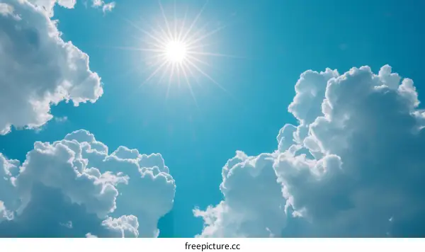 Blue sky and white clouds with a bright shining sun