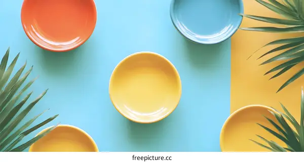 Minimalist Flat Lay Photography With Palm Leaves and Colorful Bowls