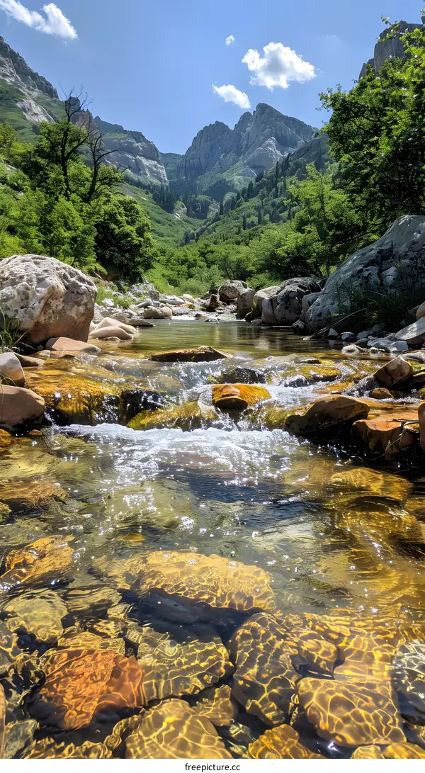 Crystal Clear River Flowing Through Mountain Valley