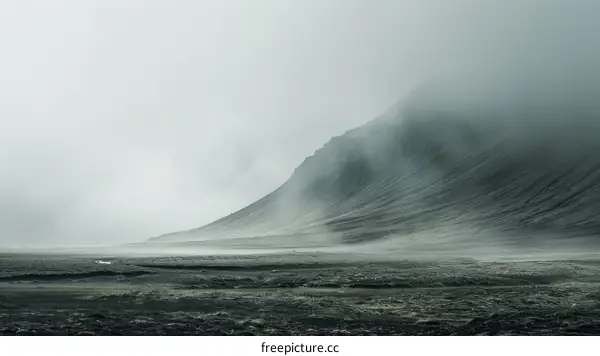 Foggy Mountain Landscape with Dark Green Hills