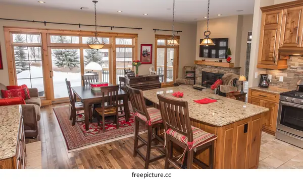 Open concept kitchen with wood cabinets and granite countertops