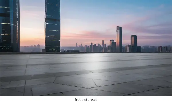 City skyline at dawn with modern buildings and empty ground