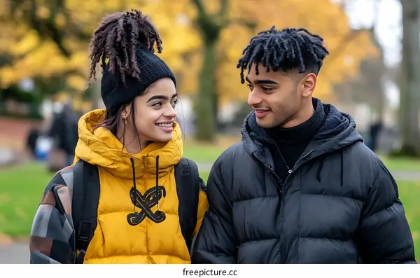 Young Couple in Love Smiling at Each Other Outdoors