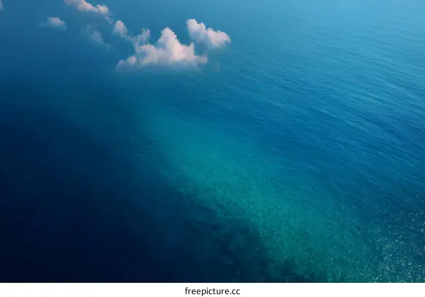 High Angle View of Tranquil Ocean Waters and Clouds