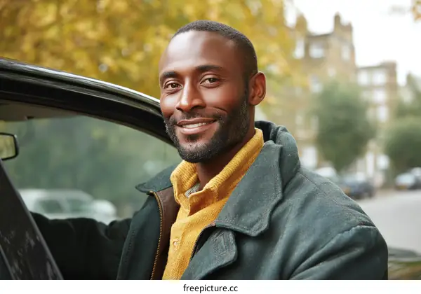 Smiling African Man Getting Into Car