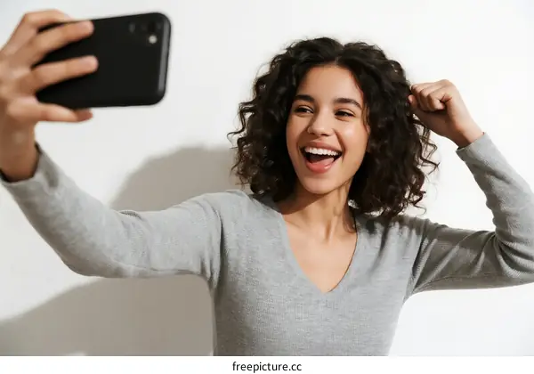 Happy woman taking a selfie with a smartphone