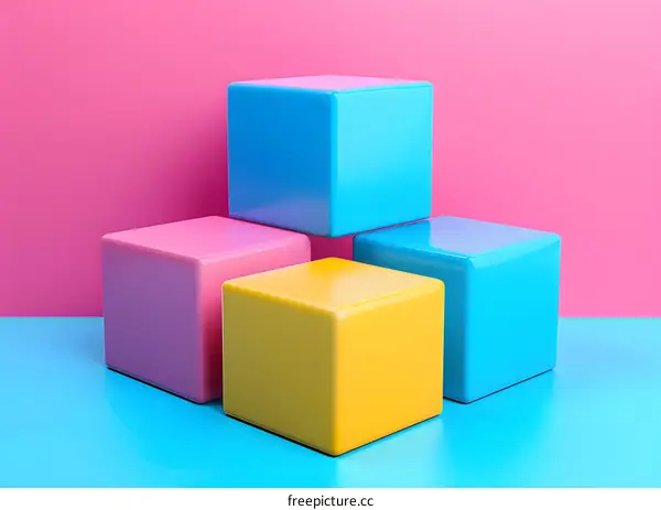 Four 3D cubes in blue, pink, and yellow on blue and pink background