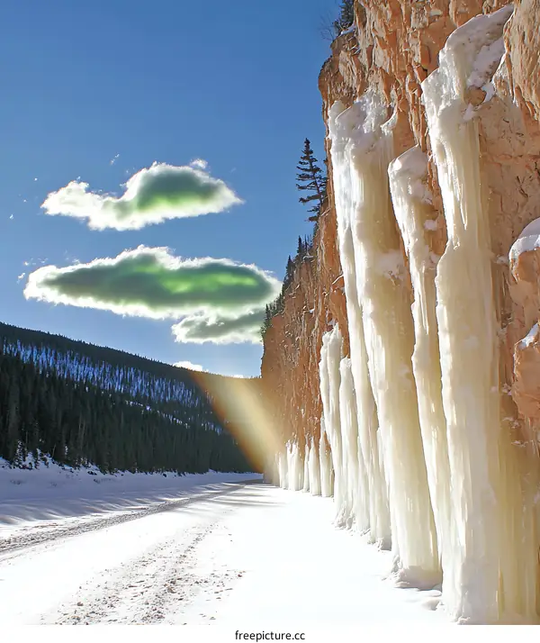 Frozen Waterfall With Rainbow On A Sunny Day
