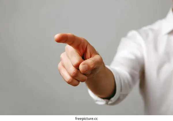 Close-up of a Hand Pointing Foreward