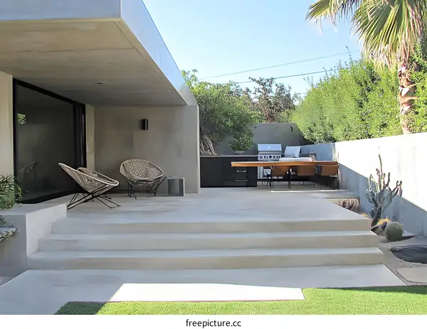 Modern Patio Design with Concrete Steps and Minimalist Furniture