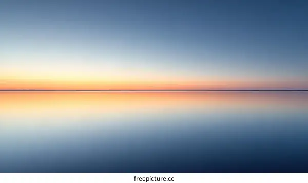 Calm Horizon at Sunrise over Still Water