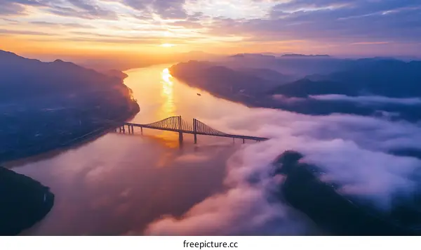 Sunrise over the Bridge and Misty River