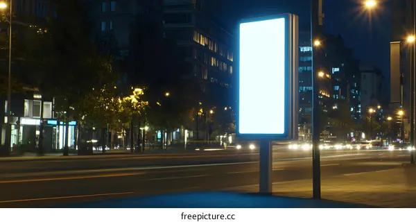 Blank Billboard On City Street At Night