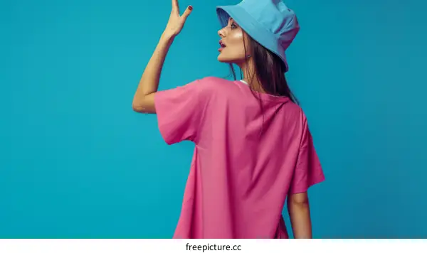 Fashionable Woman in Pink T-shirt and Blue Bucket Hat
