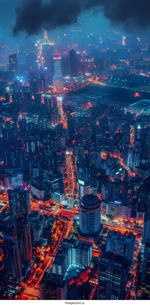 A bird's eye view of a brightly lit city at night with skyscrapers and highways