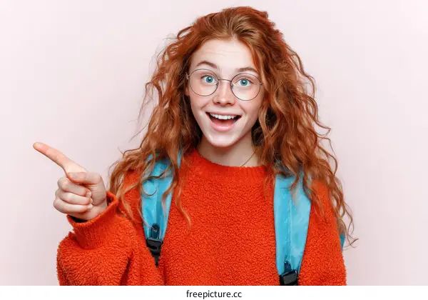 Teenage Girl with Red Hair Pointing