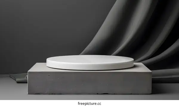 Minimalist Product Display with Gray Background and Fabric