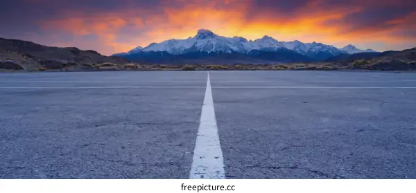 Sunrise over the Mountains Asphalt Runway
