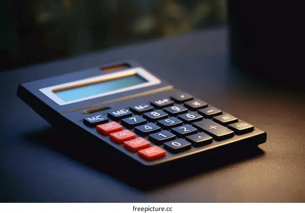 Close-up of a Modern Calculator on a Dark Surface