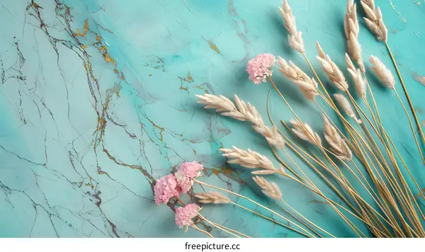 Dried Flowers on Turquoise Marble Background