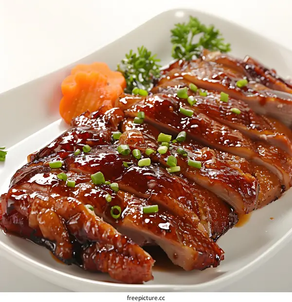 Sliced Roast Duck on a White Plate