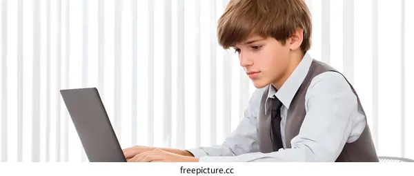 Young Caucasian Businessman Working on Laptop