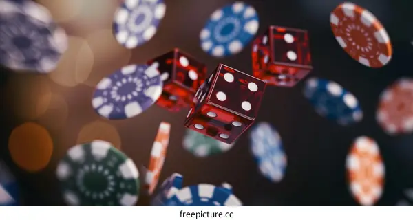 Red and Blue Casino Chips with Dice Falling