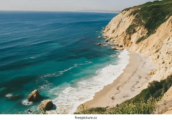 Aerial View of Secluded Beach with Cliffside