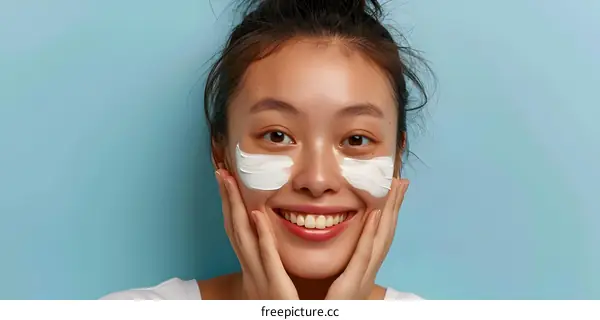 Smiling Woman Applying Face Mask