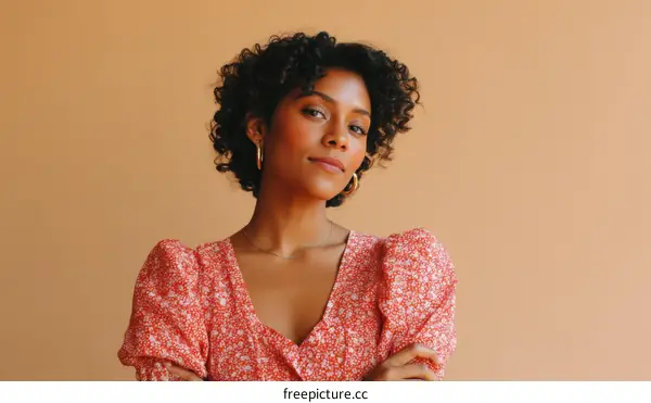 Woman in a Floral Print Dress against a Beige Background