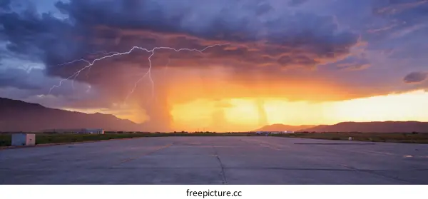 Dramatic Sunset Storm Over Airport Runway